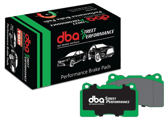 A black and green box labeled "dba Street Performance Performance Brake Pads" with illustrations of cars, next to a pair of brake pads with green edges and "dba Street Performance" printed on them.